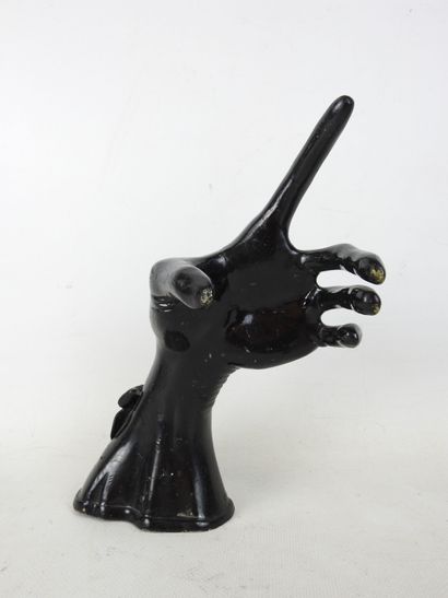 HAND wearing a fine black lacquered metal...