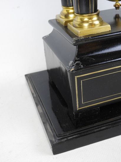 Black lacquered wood and gilt brass portico...