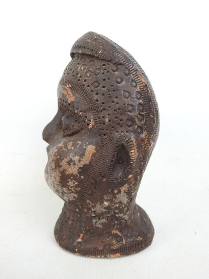 FACE of a blower in terra cotta with brown...