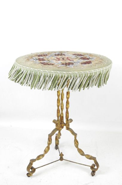 Gilded, twisted wrought-iron tilt-top GUERIDON,...