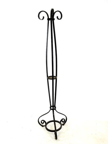 LAMP STAND in wrought iron resting on a tripod...