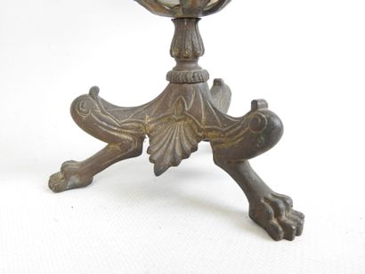 CUP resting on three regule claw feet supporting...