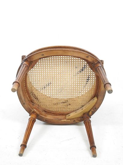 Walnut caned armchair, molded and carved...