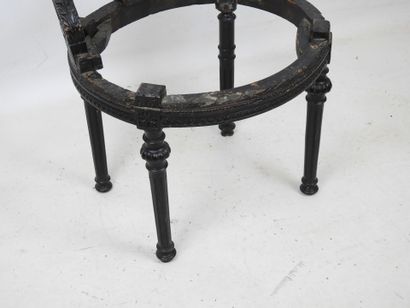 A black lacquered wood child's chair with...
