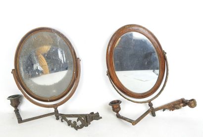TWO double wooden mirrors resting on an articulated...