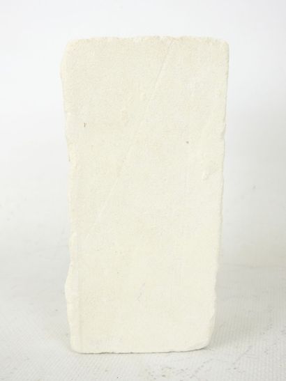FACE sculpted from a block of plaster. Signed...