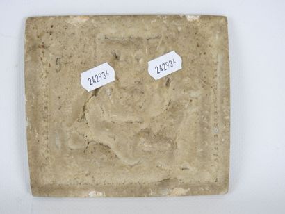 Low-relief plaque in petrified stone, decorated...