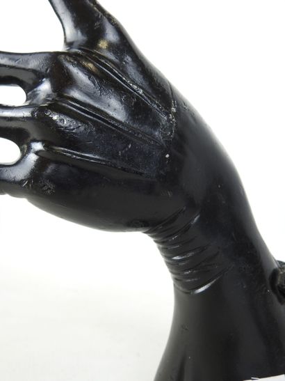 HAND wearing a fine black lacquered metal...