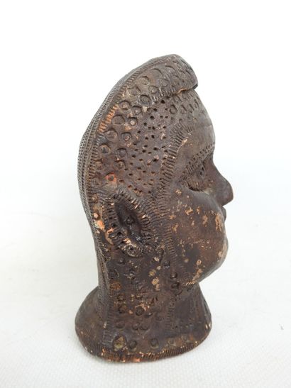 FACE of a blower in terra cotta with brown...