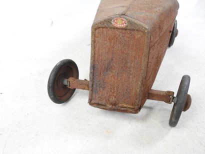 EUREKA: Pedal car in red painted sheet metal....