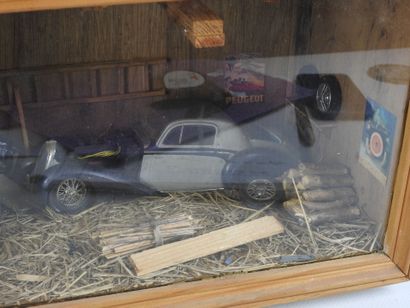 DIORAMA of a garage with motorcycle and automobile....