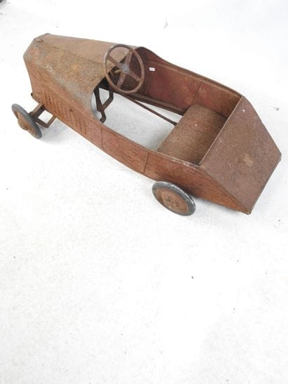 EUREKA: Pedal car in red painted sheet metal....
