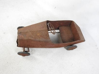 EUREKA: Pedal car in red painted sheet metal....