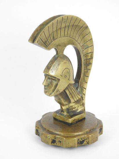 AUTOMOBILE MASCOTTTE decorated with a helmeted...