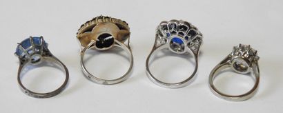 Four rings set in 925 sterling silver, adorned...