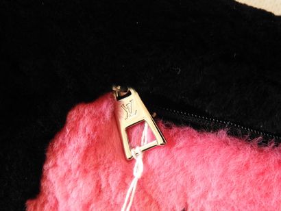 Louis VUITTON
Sleeve with monogrammed center...
