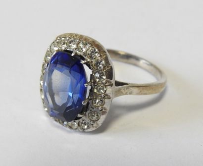 Eight rings set in silver, adorned with blue,...
