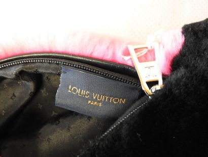 Louis VUITTON
Sleeve with monogrammed center...