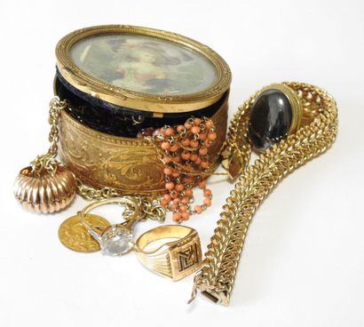 In a circular gilded metal box, lot of costume...