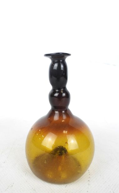 BALSAMAIRE in amber glass. H. 12 cm . Firing...