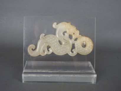 CHINA: Dragon holding a carved white nephrite...