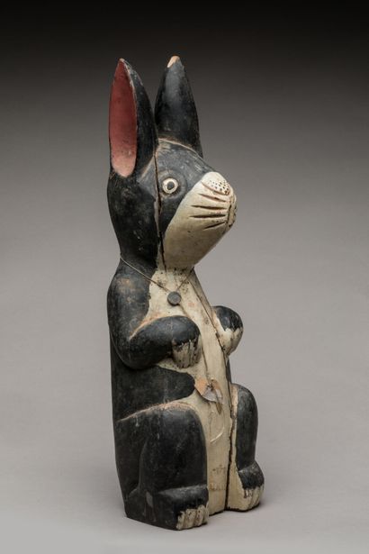 THAILAND.
Wooden votive statue carved with...