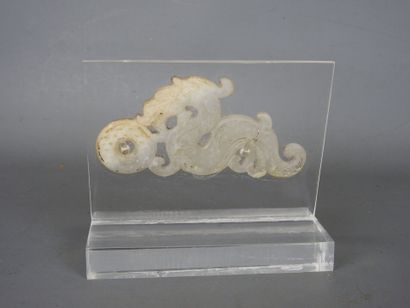 CHINA: Dragon holding a carved white nephrite...