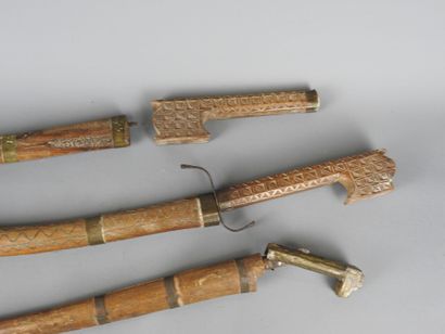 ALGERIA 
Three wooden short swords and scabbards...