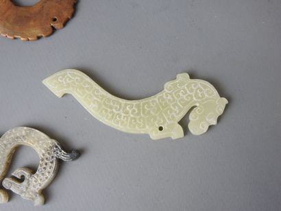 Three jade motifs (chimera or dragon). L...