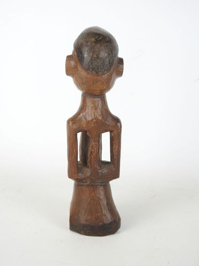 STATUETTE Fétiche masculine en bois sculpté....