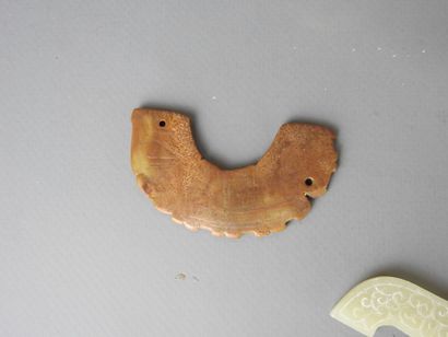 Three jade motifs (chimera or dragon). L...