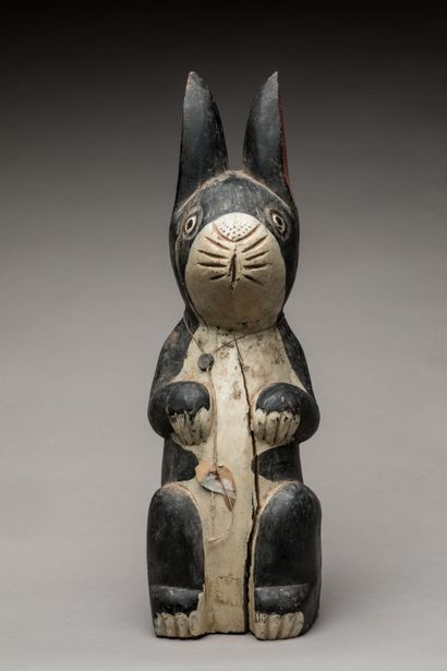 THAILAND.
Wooden votive statue carved with...