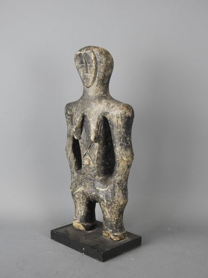 MALI: Carved stone statue of a female figure...
