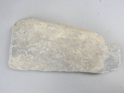 Stone amulet with carved inscription decoration....