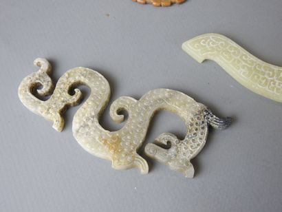Three jade motifs (chimera or dragon). L...
