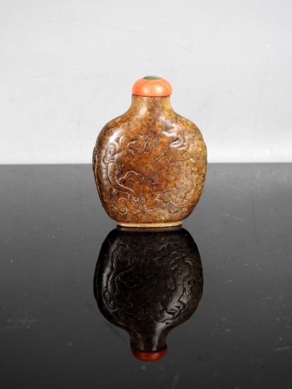 CHINA - 19th century
Flat-shaped brown jade...