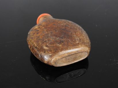 CHINA - 19th century
Flat-shaped brown jade...