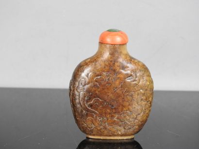 CHINA - 19th century
Flat-shaped brown jade...
