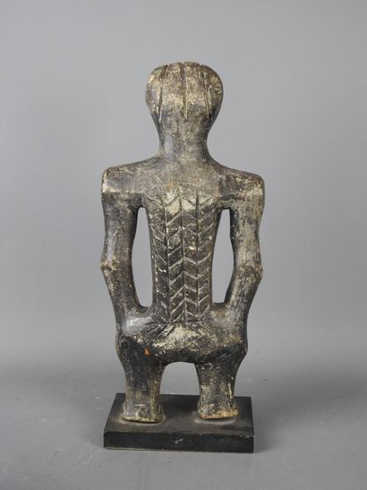 MALI: Carved stone statue of a female figure...