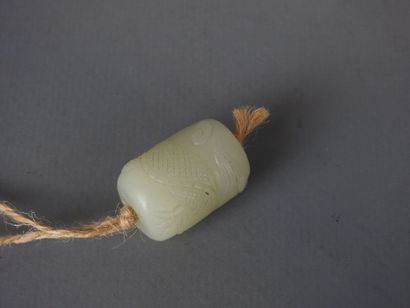 Jade pendant carved with a dragon. Height:...