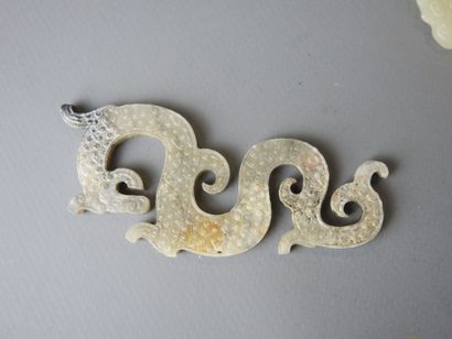 Three jade motifs (chimera or dragon). L...
