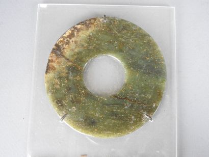 CHINA: BI disc in green jade. Mounted on...