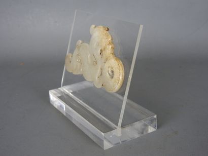 CHINA: Dragon holding a carved white nephrite...