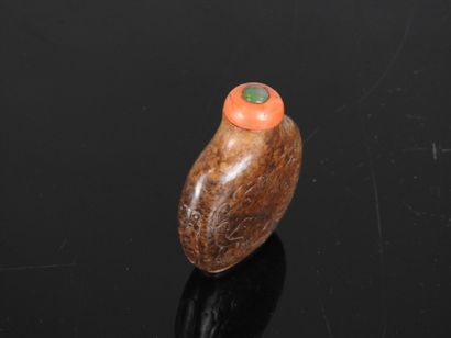 CHINA - 19th century
Flat-shaped brown jade...