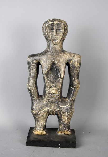 MALI: Carved stone statue of a female figure...