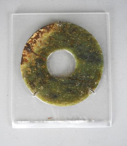 CHINA: BI disc in green jade. Mounted on...