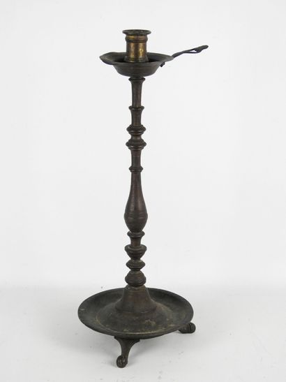 OTTOMAN CANDLESTICK in patinated bronze with...