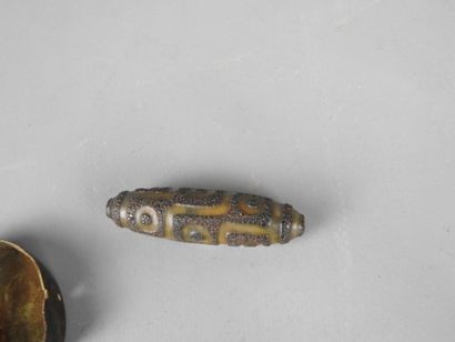 TIBET: DZI resin amulet. L: 7 cm. 
A small...