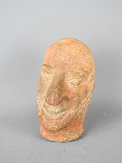 Carthaginian-style baked head of a man with...