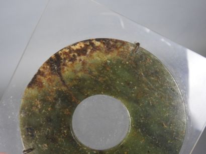 CHINA: BI disc in green jade. Mounted on...